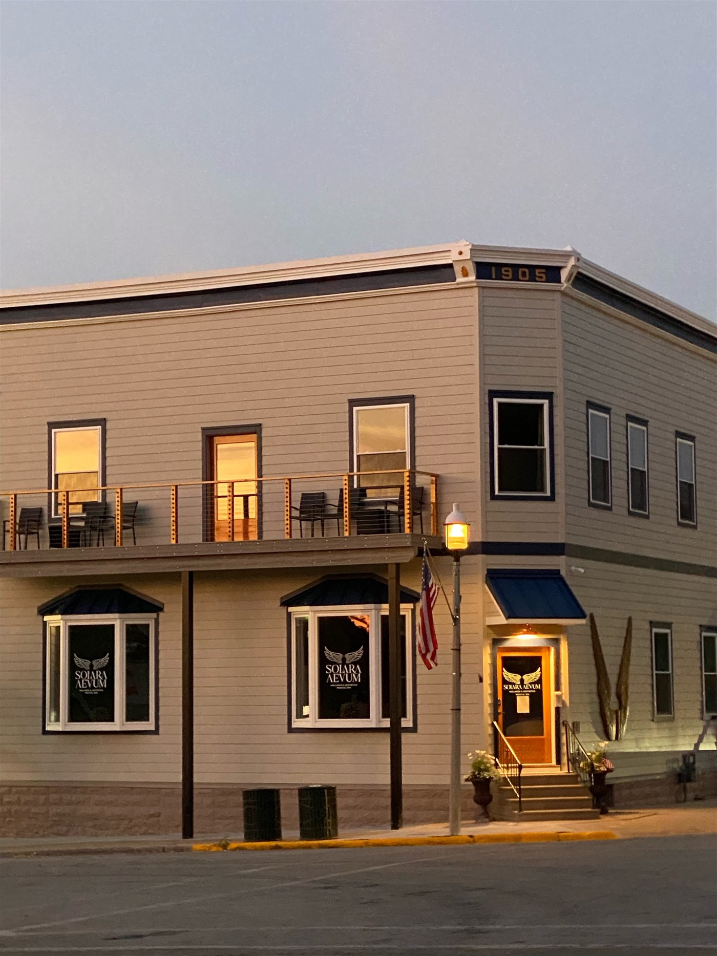 The historic Solara Aevum building in downtown Green Lake, Wisconsin, at golden hour