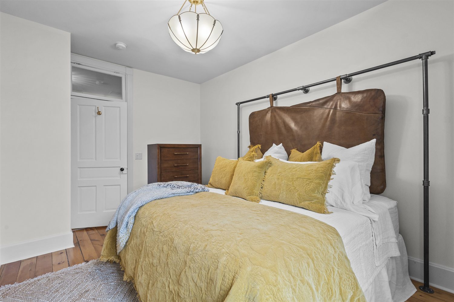 The Golden Hour Room with warm golden linens