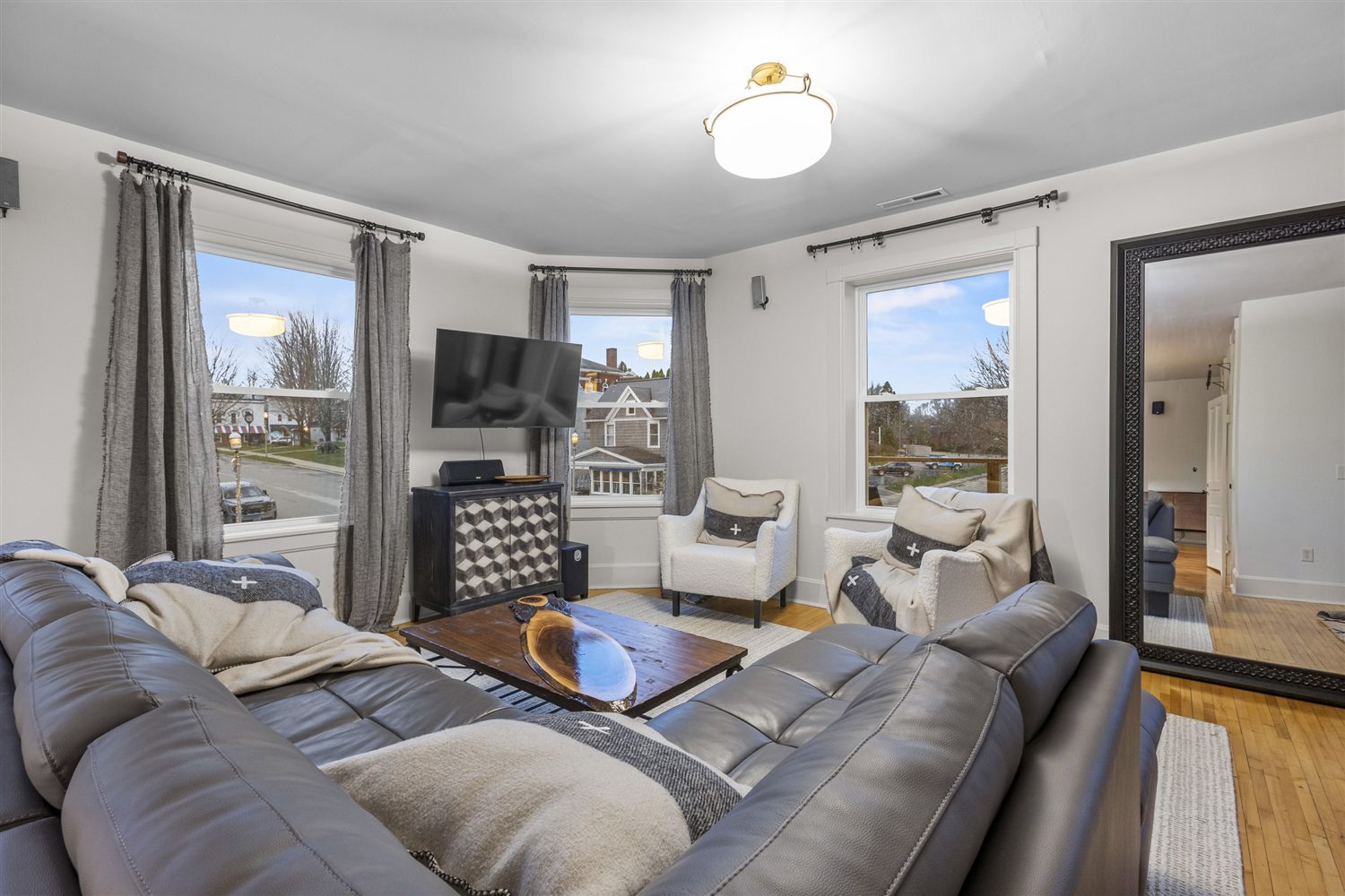 The light-filled living and gathering space at Solara Retreats, with lake views