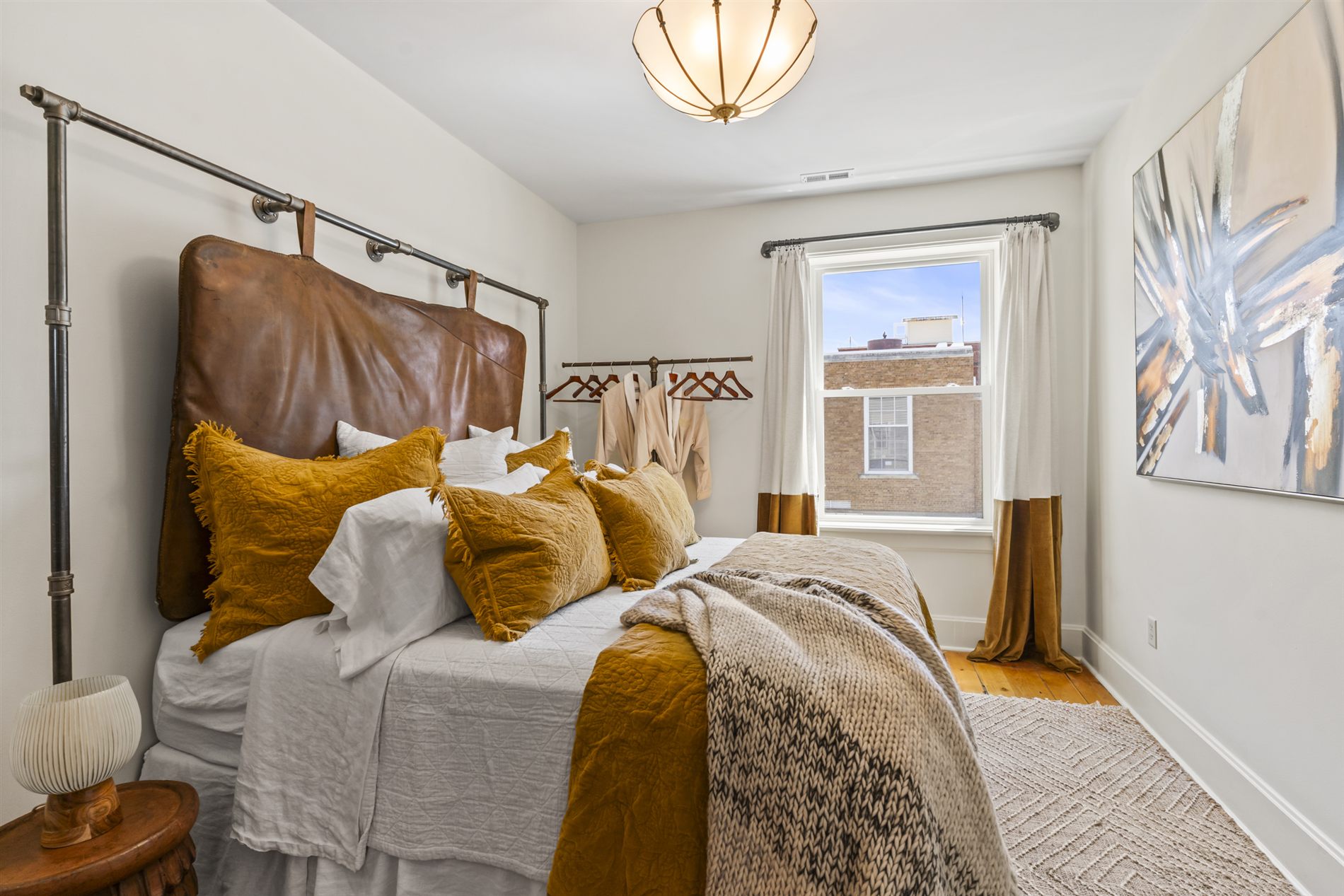 The Golden Hour bedroom, dressed in warm velvet linens