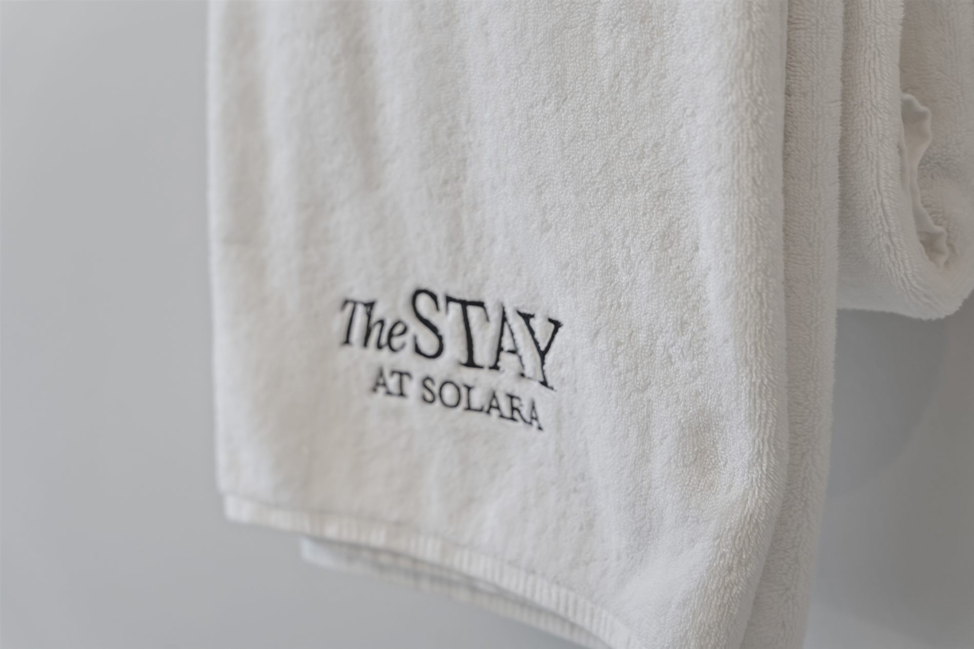 A plush robe, monogrammed for The Stay at Solara